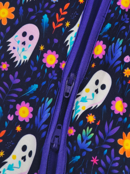 Close-up of Ghost Floral Bamboo Zipper Sleeper featuring colorful ghosts and flowers on a dark background.