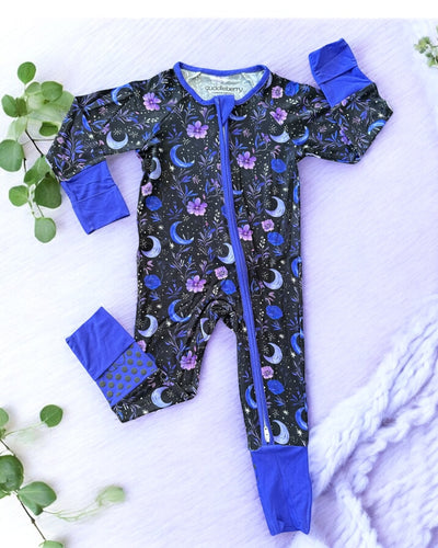 Purple Moonbeam bamboo zipper sleeper for babies with floral and moon patterns, designed for comfort and warmth.