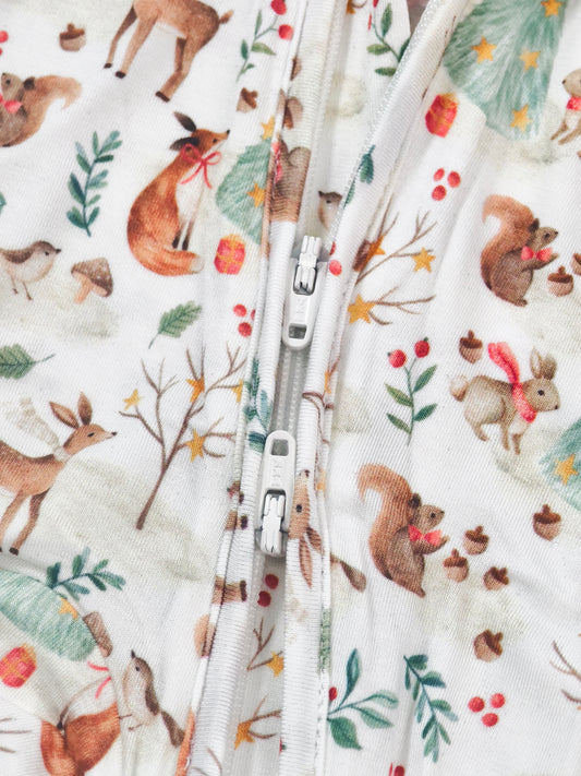 Woodland Christmas Animal Bamboo Zipper Sleeper featuring cute animals and festive patterns for babies.