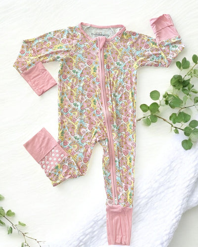 Mama Bamboo Zipper Sleeper for babies in colorful patterns with dual zipper design and soft pink accents.