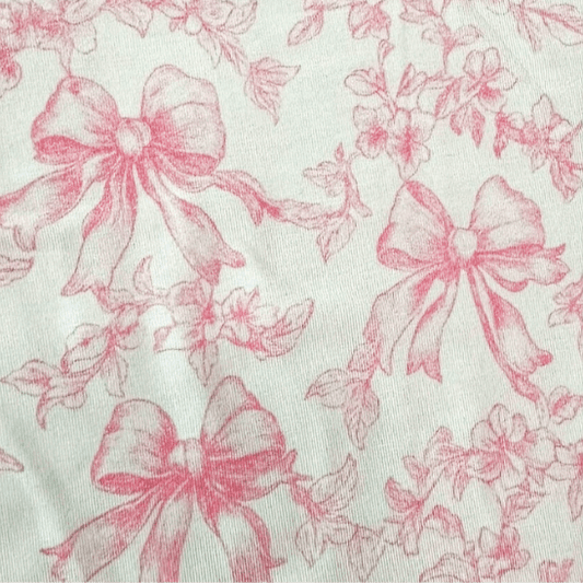 Close-up of pink bows and floral pattern, ideal for the Toile Bows Bamboo Bodysuit design.